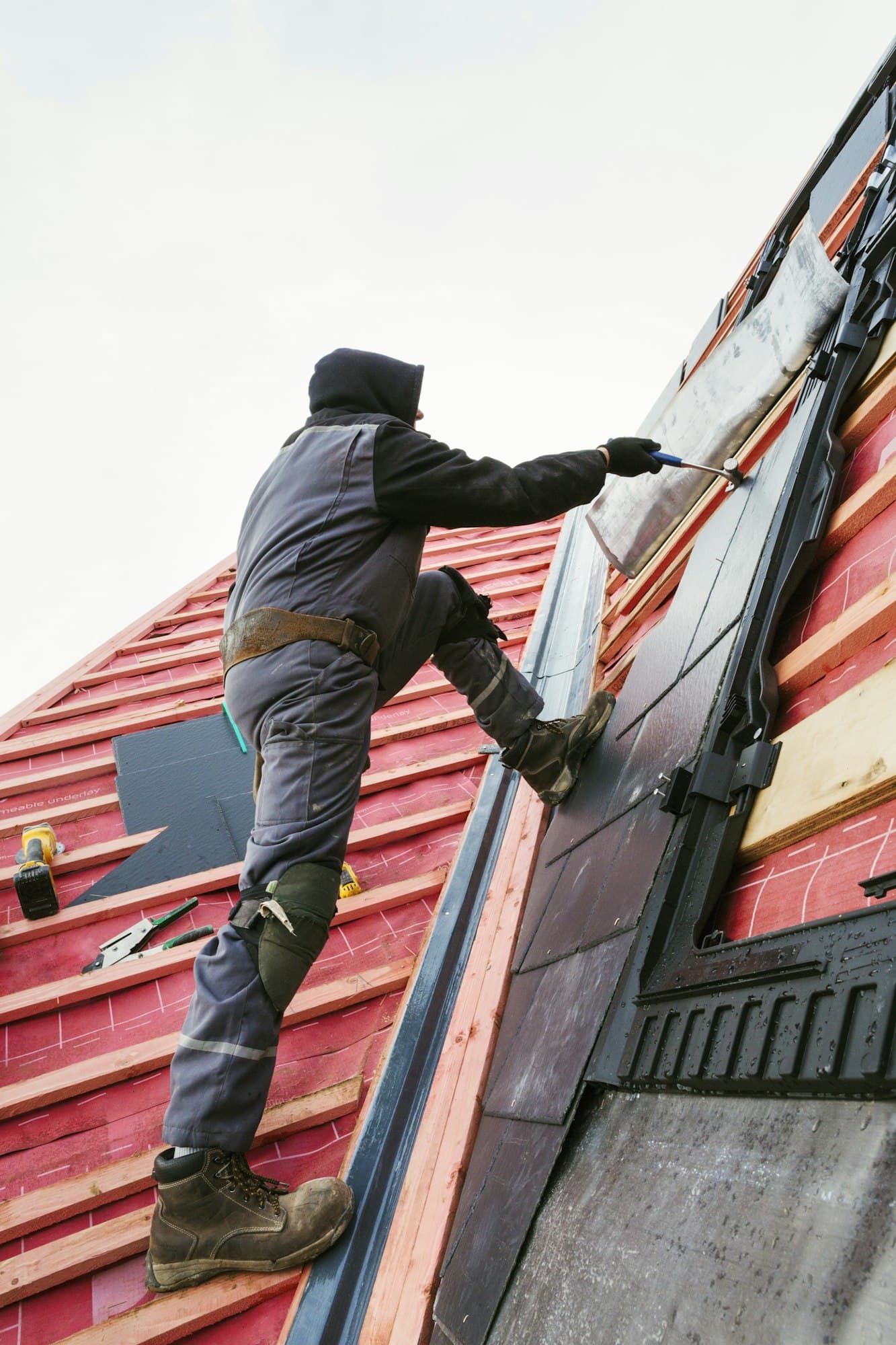 Roofer working on tiles